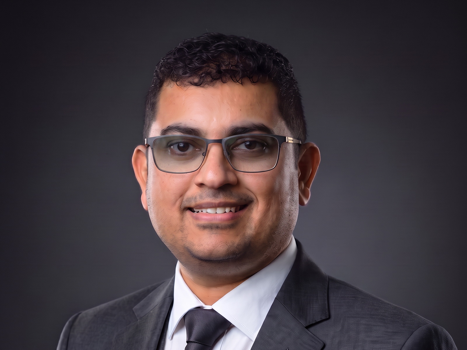 Portrait of Eby Mathew, Co-Founder & Executive Director, DAEB Group