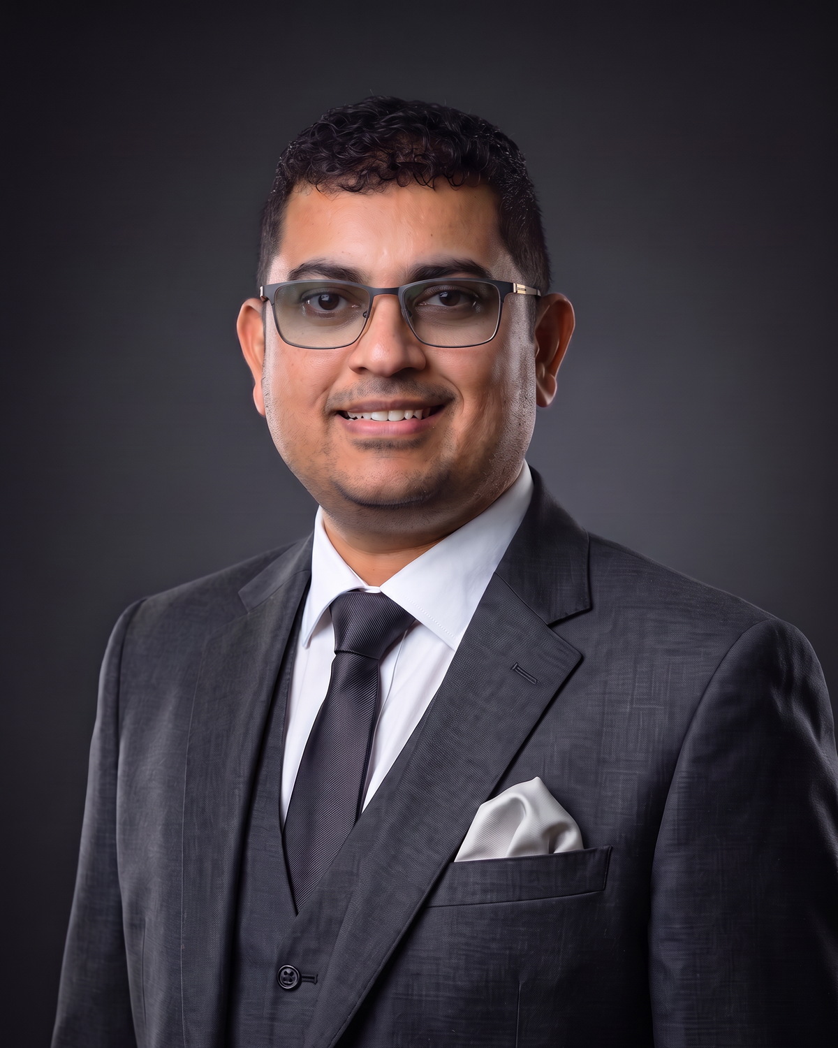 Portrait of Eby Mathew, Co-Founder and Executive Director of DAEB Group